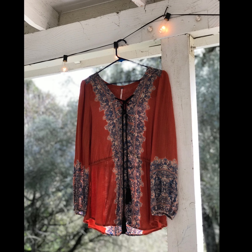 Free people blouse with tassels